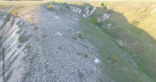 flying over beautiful white chalk hills with grass in summer