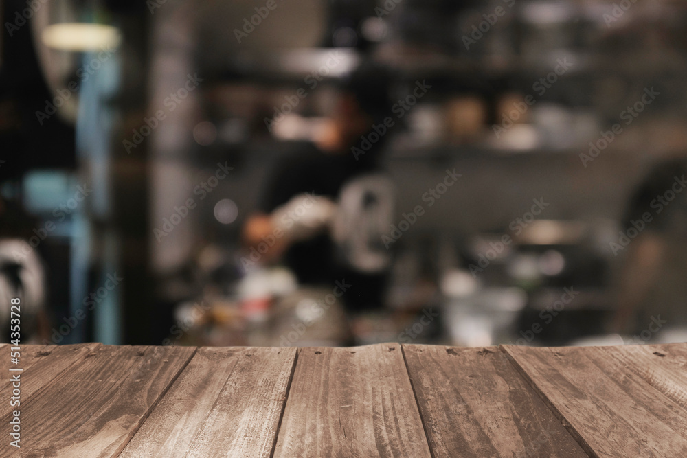 Wood top table blur kitchen in restaurant background .For montage product display or design key visual layout. Wood top table blur kitchen in restaurant background .For montage product display or design key visual layout.