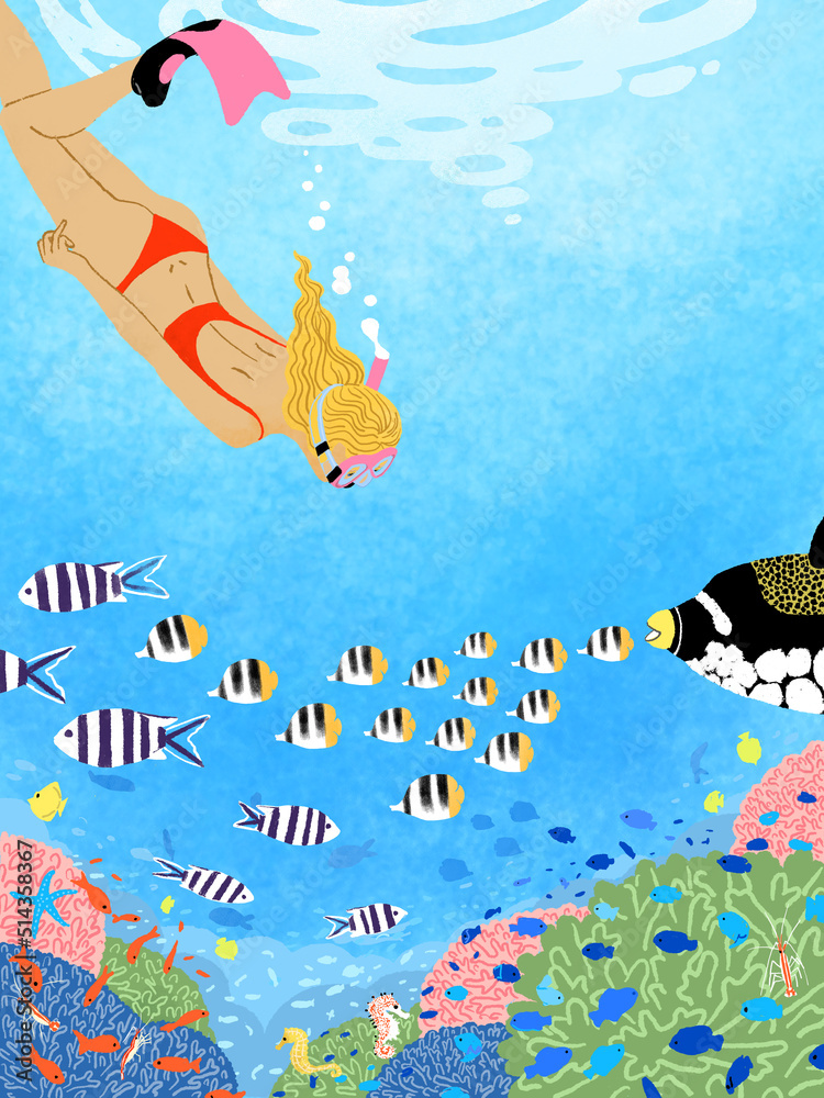 Obraz premium 海に潜ってシュノーケリングで魚の観察を楽しむ女性