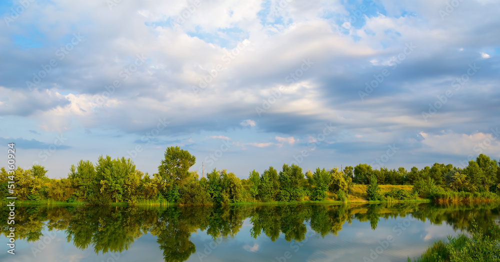 Obraz premium quiet summer river with forest on coast