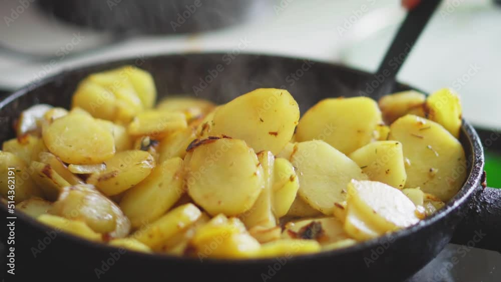 Fried potatoes. Young potatoes are fried in a frying pan. Toasted crispy crust. Natural, healthy food at home Fried potatoes. Young potatoes are fried in a frying pan. Toasted crispy crust. Natural, healthy food at home