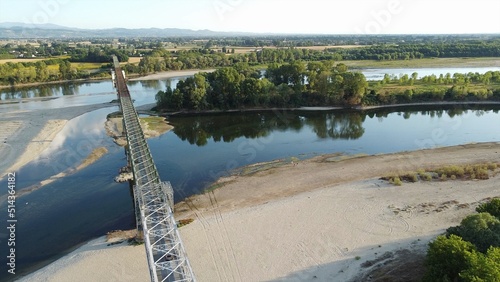 Italy - drought and aridity in the almost waterless Po river with large expanses of sand and no water - climate change and global warming, Drone view in Ponte bella Becca Pavia Lombardy and Ticino