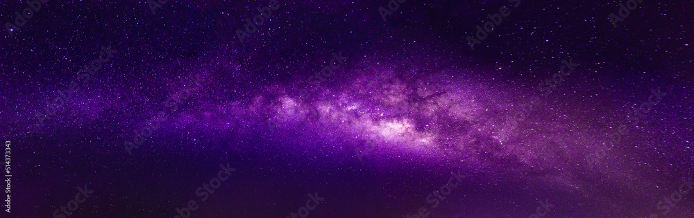 Milky way in the night sky and stars on dark background with noise and grain. Photo taken with long exposure and white balance selected. Milky way in the night sky and stars on dark background with noise and grain. Photo taken with long exposure and white balance selected.