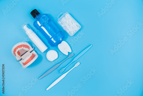 Shot of Oral dental care equipment putting in blue background.  photo