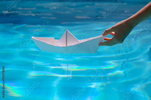 Paper ship and ocean water. Paper boat sailing on sea water with waves.