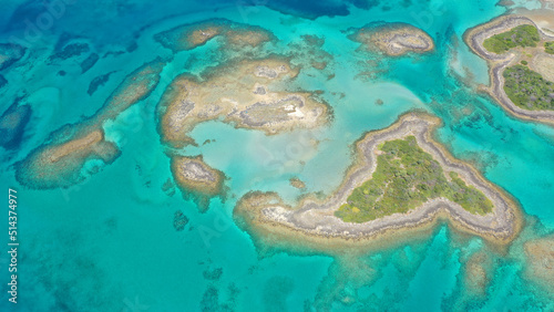 Aerial drone photo of paradise volcanic island complex resembling a blue lagoon archipelago in exotic destination bay with deep turquoise sea and crystal clear water beach