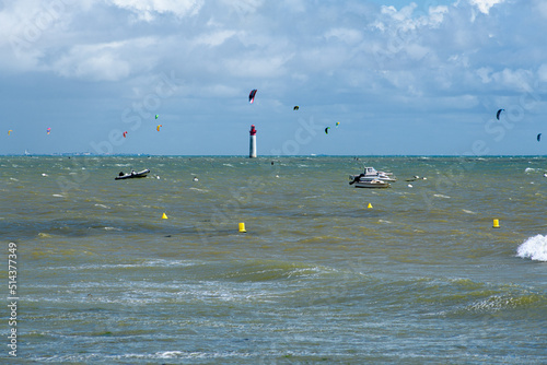 Viewe from plage de Notre dame at Saint-Marie-de-Re on the Anse Notre Dame at high tide with boats and kite surfers