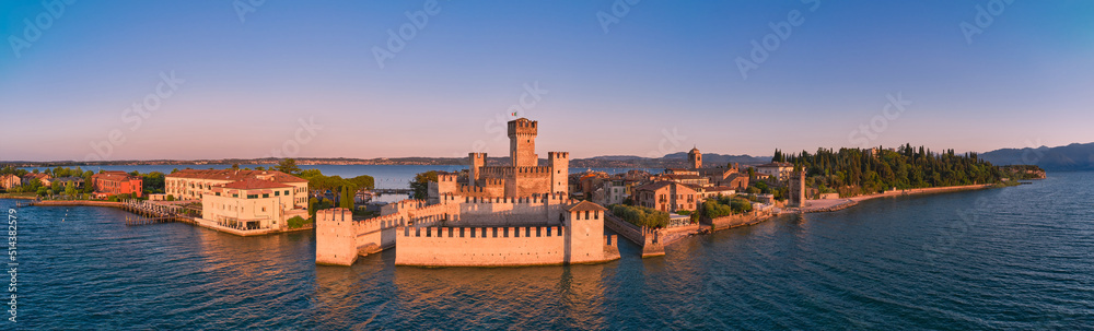 Panorama of Sirmione castle in Italy at dawn aerial view. Sirmione, lake garda aerial panorama.