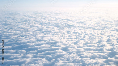 Beautiful cloudy blue sky from airplane window  view from above.Beautiful light natural background copyspace for text