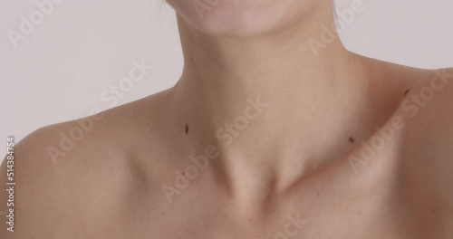 Woman with bare shoulders enjoying of her soft skin and beauty treatment