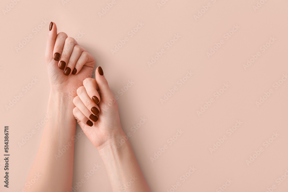 Female hands with beautiful brown manicure on light background - obrazy, fototapety, plakaty 