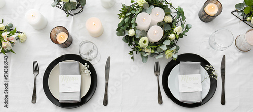 Beautiful wedding table setting with floral decor and candles