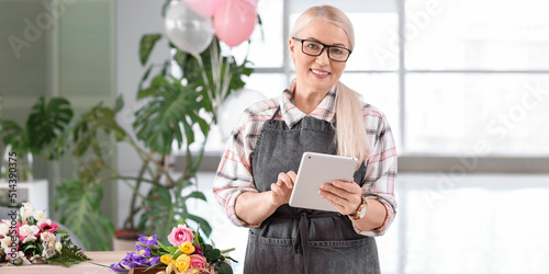 Mature female florist with ...