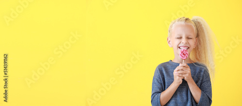 Cute little girl with lolli...
