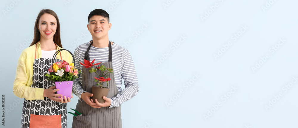 Portrait of florists with plant and bouquet on light background with space for text