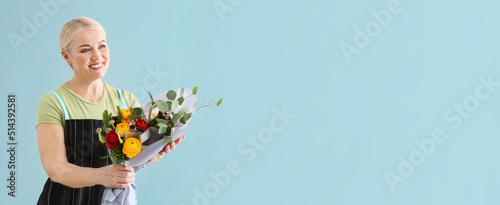 Mature female florist holdi...