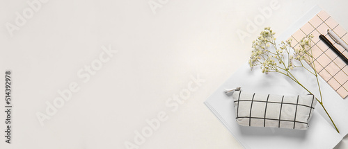 Pencil case  flowers and stationery on white background with space for text