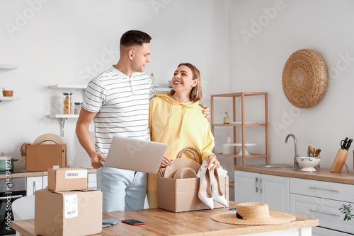Young couple with laptop un...