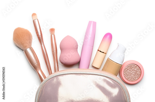 Bag with makeup accessories and cosmetics on white background, closeup