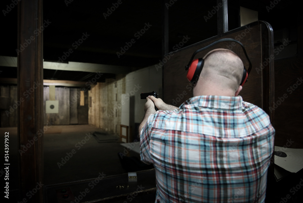 Pistol bullseye target training in a shooting room