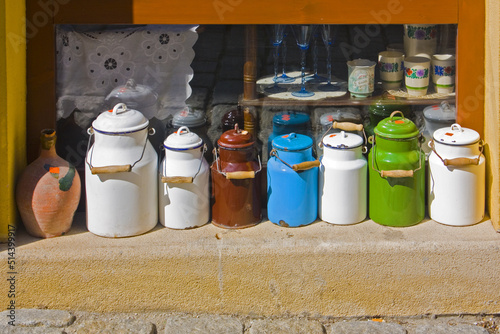 Colorful milk cans in antiquarian store in Bratislava photo