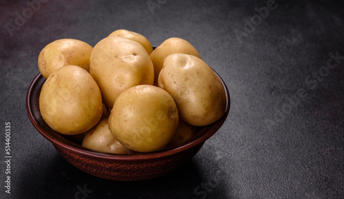 A pile of young potatoes on the table. The benefits of vegetables