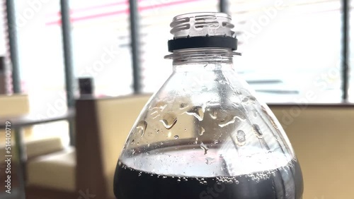 cola carbonated drink. American drink in a plastic bottle in a fast food cafe at a gas station. cola lemonade drink lifestyle. drink with ice in cafe