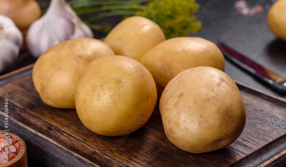 A pile of young potatoes on the table. The benefits of vegetables A pile of young potatoes on the table. The benefits of vegetables