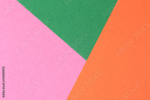 green, orange and pink paper sheet background