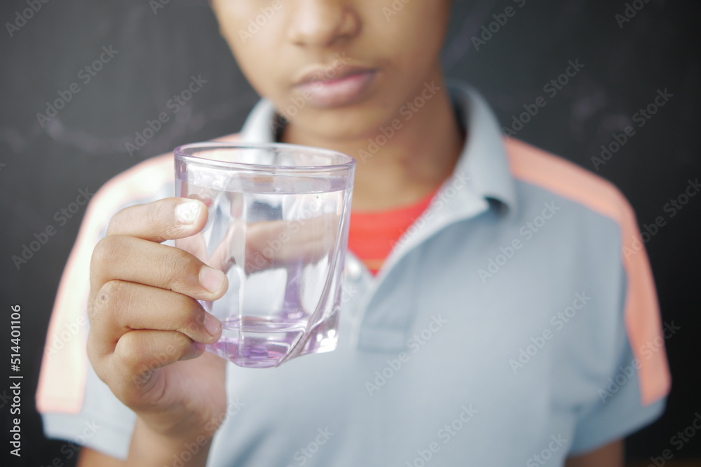 teenage boy drinking glass of water selective focus teenage boy drinking glass of water selective focus