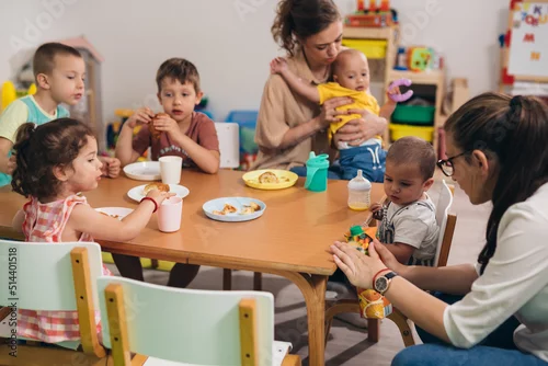 Fototapeta na wymiar children have breakfast in kindergarten