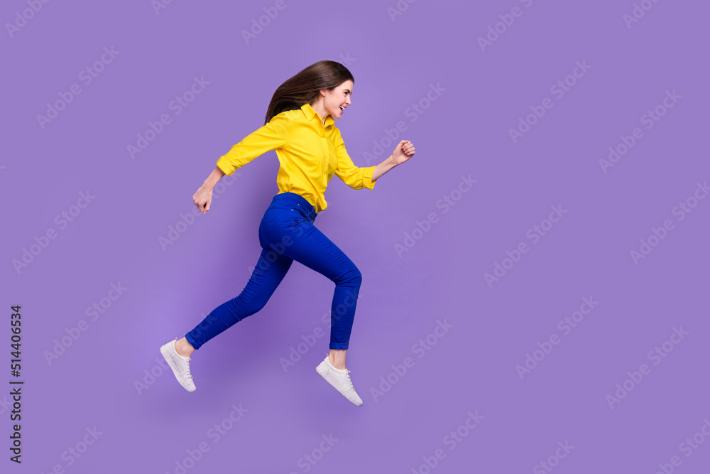 Full length body size view of attractive cheery girl jumping running copy space isolated over bright violet purple color background
