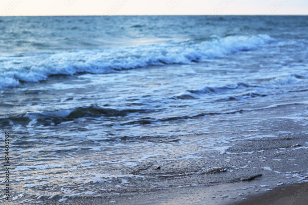 blue foamy waves on the beach blue foamy waves on the beach