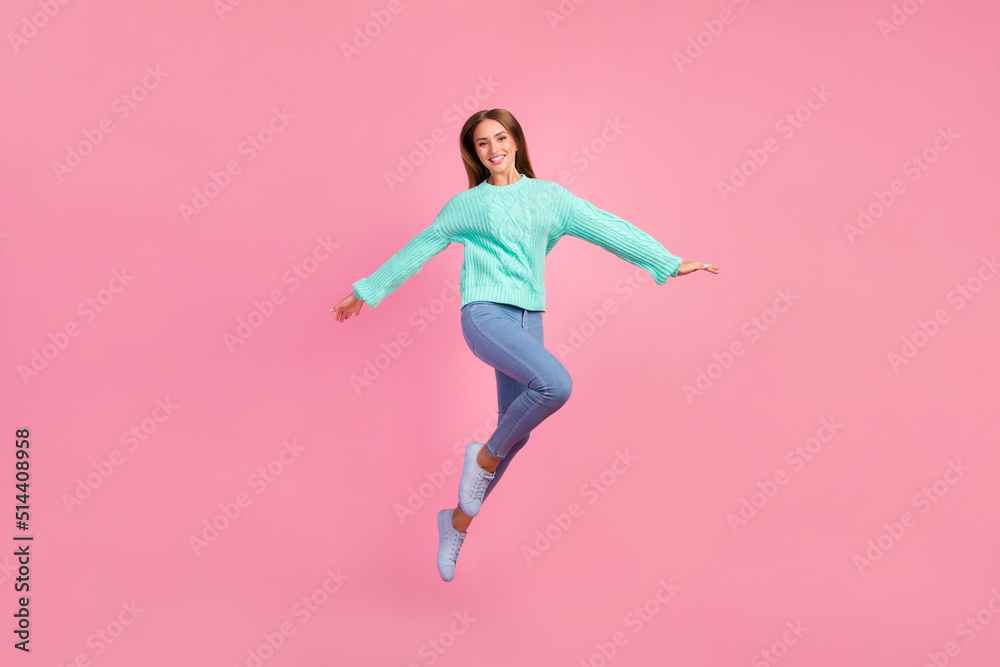 Full length portrait of excited cheerful person arms wings flying jumping isolated on pink color background