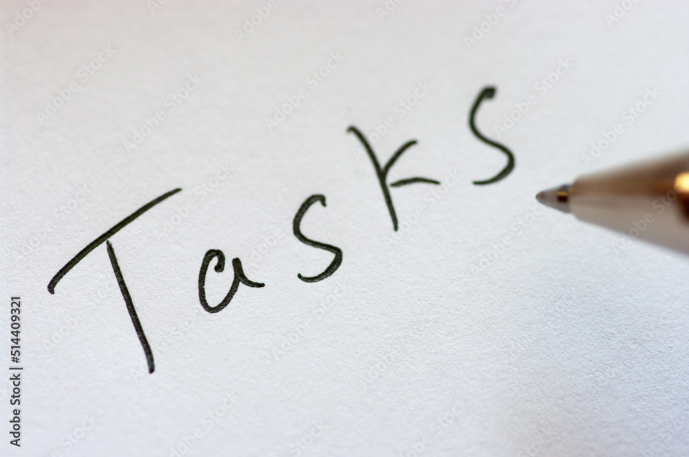 Close up image of handwritten word TASKS. Close up image of handwritten word TASKS.
