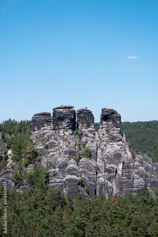 Monumental Bastei sandstone pillars and rock formation near Kurort Rathen village in the national park Saxon Switzerland by Dresden and Czechish border, Saxony, Germany.