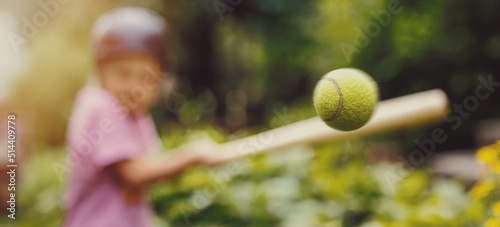 Canvas Print little girl hitting tennis ball with baseball bat at park