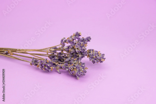 Fototapeta Naklejka Na Ścianę i Meble -  Dry lavender flower aroma on the violet background