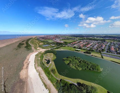 Aerial view of Fairhaven lake in Lytham St Annes with views of the coast in the background.  photo