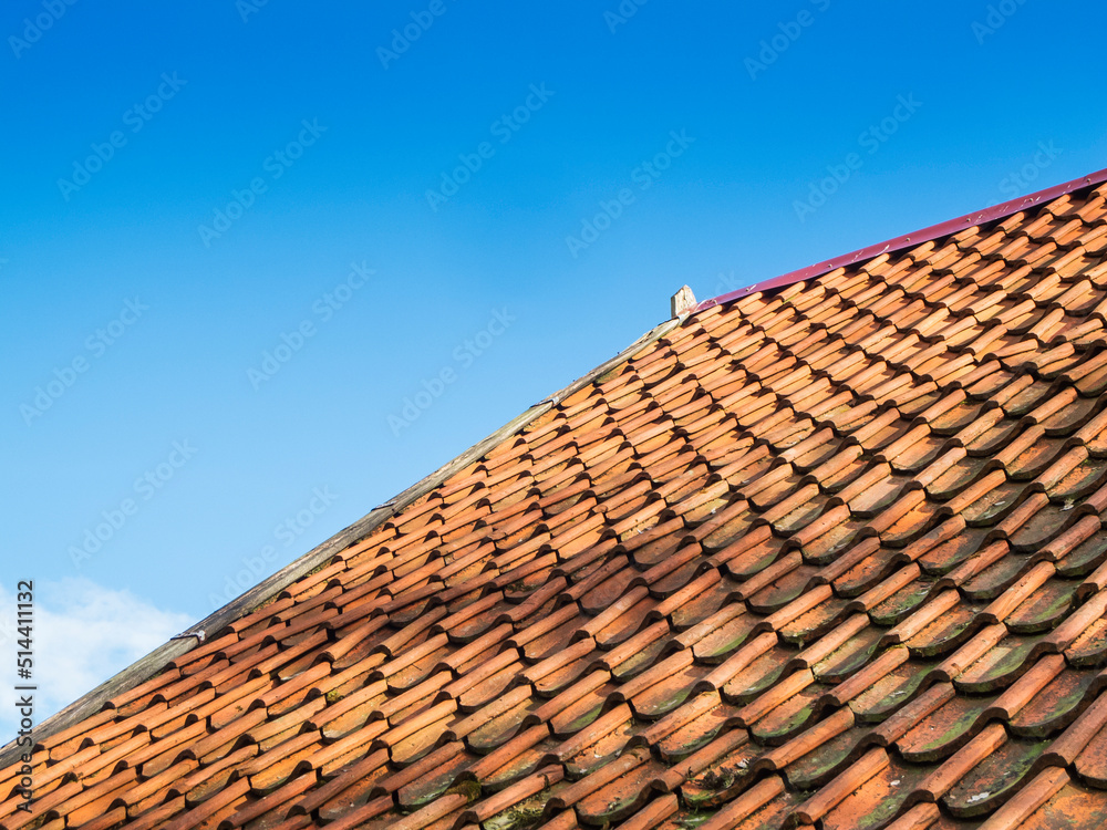 Roof shingles against a blue sky Roof shingles against a blue sky