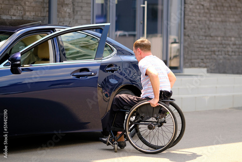 a man with a disability in a wheelchair and his car, driver with disability