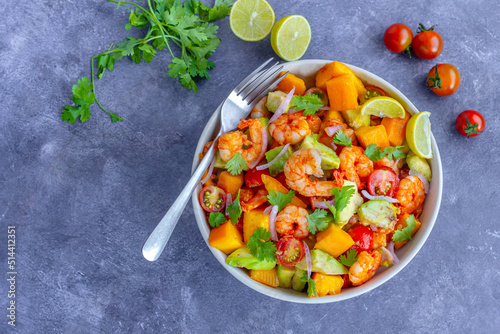 Healthy Shrimp Mango Salad with Avocado, Cherry Tomatoes and Onion, Garnished with Fresh Cilantro