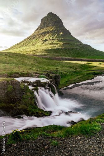 famous Kirkjufell with waterfall during summer