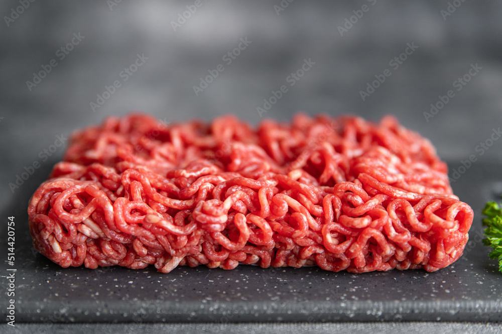 raw minced meat pork, beef, lamb cuisine fresh healthy meal food snack diet on the table copy space food background rustic top view raw minced meat pork, beef, lamb cuisine fresh healthy meal food snack diet on the table copy space food background rustic top view