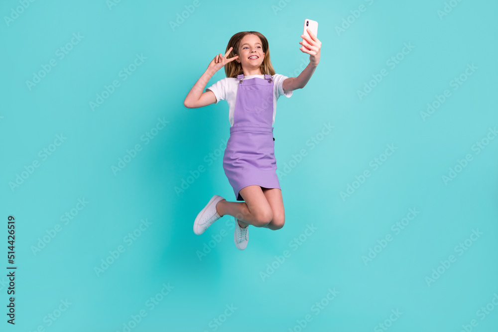 Full body portrait of crazy adorable person jump take selfie show v-sign isolated on turquoise color background