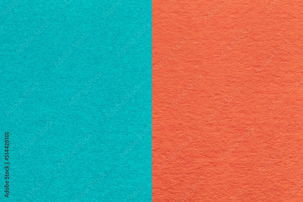 Texture of craft cerulean and orange paper background, half two colors, macro. Structure of vintage dense cyan cardboard. Texture of craft cerulean and orange paper background, half two colors, macro. Structure of vintage dense cyan cardboard.