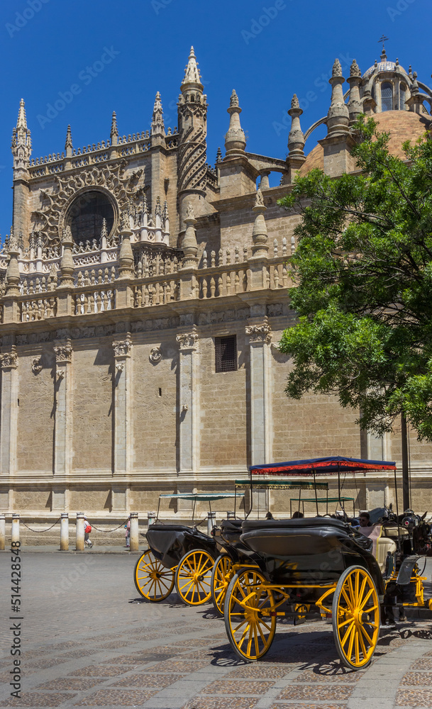 Naklejka premium Horse carriage in front of the cathedral of Sevilla, Spain
