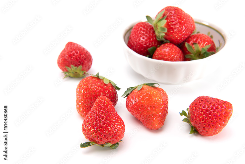 Fresh ripe strawberries in ceramic bowl and on white background. japanese fruit. Selective focus Fresh ripe strawberries in ceramic bowl and on white background. japanese fruit. Selective focus