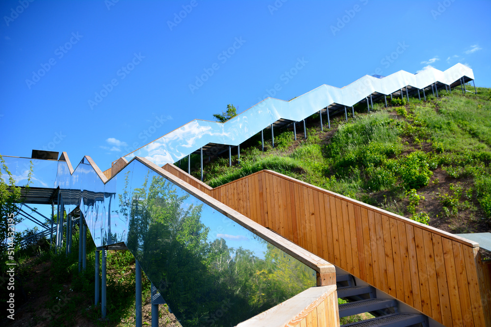 Fototapeta premium staircase in shape of zigzag going up to the sky