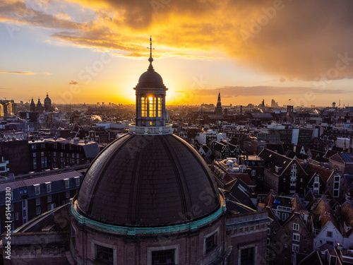 Fotografie, Tablou Beautiful Sunset Behind The Open Tower Of A Church In Amsterdam